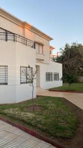 a house with a tree in front of it at Big Villa In Rabat in Rabat
