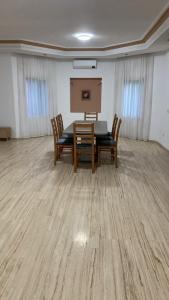 a room with a table and chairs and a podium at Big Villa In Rabat in Rabat
