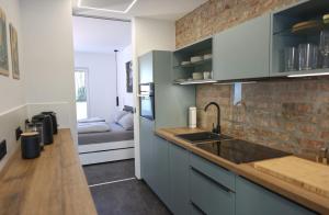 a kitchen with a sink and a counter top at Ferienwohnung Petra in Ilmenau