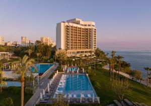 an aerial view of a resort with a pool and a building at Akra Antalya in Antalya