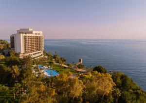 a view of a hotel and the ocean at Akra Antalya in Antalya