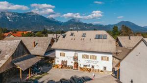 an aerial view of a town with mountains in the background at Old Bled House in Bled