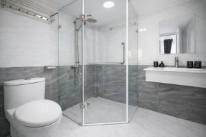 a bathroom with a shower and a toilet and a sink at 2Bi s Home Dalat 3 in Da Lat +25 photos