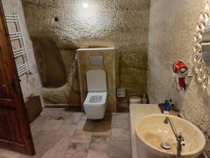 a bathroom with a toilet and a sink at Zen Cappadocia House in Göreme +140 photos