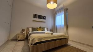 a bedroom with a bed and a large window at Vista Mare Sliema in Sliema