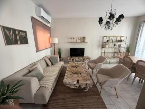 a living room with a couch and a table at Vista Mare Sliema in Sliema