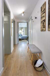 a living room with a table and a bench at MiTRa Luxury Apartments in Shumen