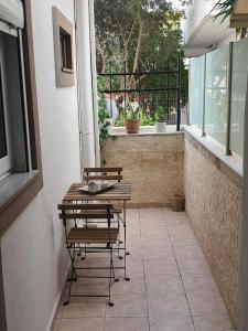 a patio with two chairs and a table and a window at Galatia Studio in Thérissos +7 photos