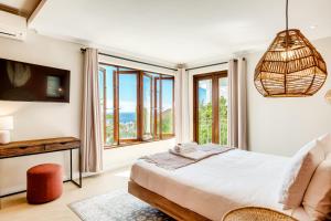 a bedroom with a bed and a large window at Song of Ascent in Cape Town +53 photos