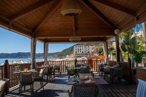 a restaurant with a view of the water at Grand Hotel Alassio Beach & Spa Resort - The Leading Hotels of the World in Alassio
