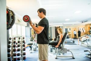 a man in a gym holding a frisbee at Thorpe Park Hotel and Spa in Leeds