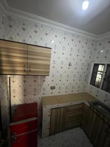 a kitchen with a sink and a counter top at Funkytee Apartments in Isasi