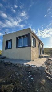 a house with windows on the side of it at Ecolodge in Potrero de Garay