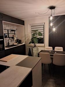 a dining room with a table and some chairs at FeWo Sasa in Blankenburg