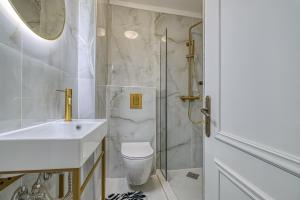 a bathroom with a toilet and a sink and a shower at Theodoros Kolokotronis in Nafplio +48 photos