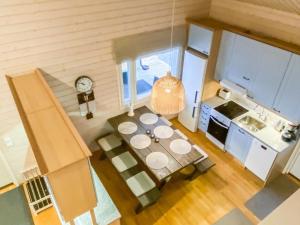 an overhead view of a kitchen with a table at Holiday Home Villa sipilä by Interhome in Savonranta +18 photos