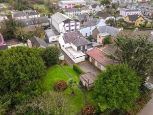 an aerial view of a residential neighborhood with houses at Orchard House - Dingle Town Centre in Dingle