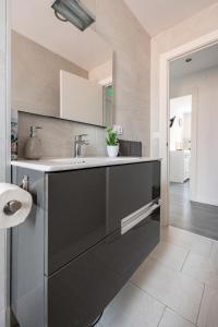 a bathroom with a sink and a toilet at Apartamento Turístico Marcelo Celayeta AT Cerca del Centro in Pamplona +54 photos