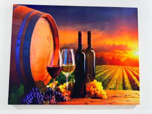 a painting of two glasses of wine and a barrel at NAPO HOTEL სასტუმრო ნაპო in Zugdidi