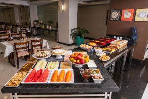 a buffet line with many different types of food at Alven Hotel by Slaviero Hotéis in Joinville