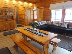 a living room with a couch and a table at Holiday Home Aaretti by Interhome in Arrakoski