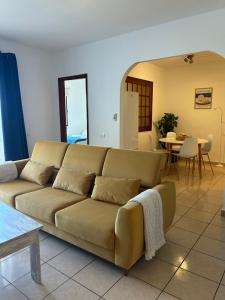 a living room with a couch and a table at Apartamento tranquilo con vistas in Los Realejos