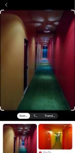 a picture of a hallway with red and green carpet at Platinum Inn Bukitbintang in Kuala Lumpur