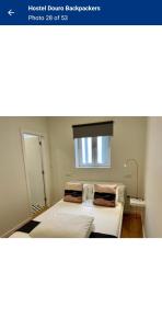 a bedroom with two beds and a window at Platinum Inn Bukitbintang in Kuala Lumpur