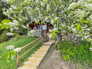 a stairway leading up to a house with a tree at Holiday Home Hellinki by Interhome in Vaskivesi