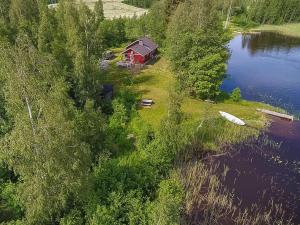 an aerial view of a house next to a lake at Holiday Home Pajaranta by Interhome in Hara