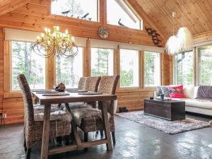 a dining room with a table and chairs at Holiday Home Homma by Interhome in Kyrö