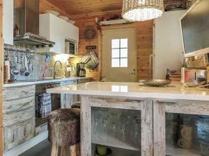 a kitchen with a large counter in a room at Holiday Home Homma by Interhome in Kyrö +21 photos