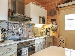 a kitchen with a sink and a stove at Holiday Home Homma by Interhome in Kyrö