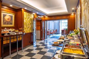 a buffet in a hotel room with food at Hotel Metropole in Lisbon +89 photos
