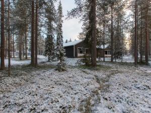 a cabin in the woods in the snow at Holiday Home Pihkala 2 by Interhome in Äkäslompolo +15 photos