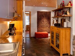 a kitchen with a sink and a counter at Holiday Home Kivalonmaa a by Interhome in Äkäslompolo +20 photos