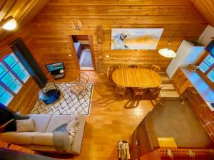 an overhead view of a living room and dining room with a table at Holiday Home Vuonkuma by Interhome in Äkäslompolo