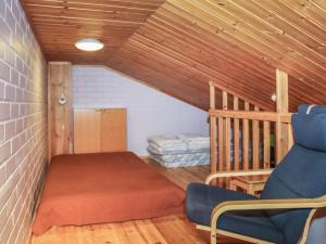 a room with a bed and a couch in a room at Holiday Home Yllästokka 7 by Interhome in Ylläsjärvi +4 photos