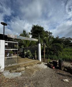 a shop with a sign that reads play house at Playa Lodge in El Valle
