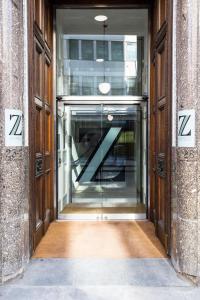 an entrance to a building with a revolving door at The Z Hotel City in London