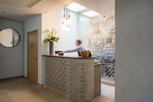 a man standing at a counter in a kitchen at The Z Hotel City in London