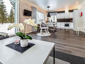 a kitchen and living room with a white counter top at Holiday Home Pallaskieppi by Interhome in Kyrö