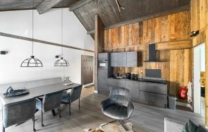 a kitchen with a table and chairs in a room at Ferienwohnung 1 Stock in Afritz