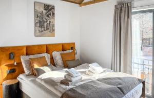 a bedroom with a large bed with towels on it at Ferienwohnung 1 Stock in Afritz