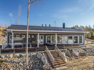 a house on the beach with aitating at Holiday Home Riemukaari by Interhome in Lihavanpää
