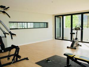 a gym with two treadmills and a treadmill at Sempurna Estate in McGregor