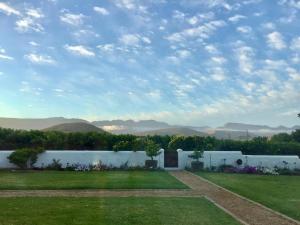 a view of a garden with mountains in the background at Sempurna Estate in McGregor +13 photos