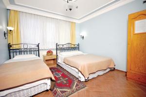 Postel nebo postele na pokoji v ubytování Side Hotel