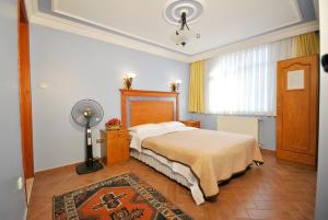 Postel nebo postele na pokoji v ubytování Side Hotel