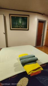 a bedroom with a bed with two pillows on it at Kochimoto Homestay in Baguio
